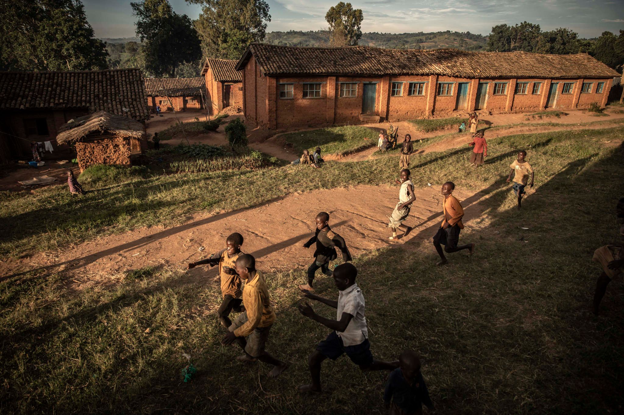 Drodro, Ituri Province, March 2021. Displaced children play soccer beside the Catholic Church. Violence has been endemic in Congo’s mineral-rich eastern regions since the official end of the civil war in 2003, but insecurity has soared in the past two years. On May 6th 2021, the government imposed a state of siege to try to end the bloodshed. A surge in attacks by armed militias and inter-communal violence in the east have killed more than 1, 500 people since 2017 as government troops and U.N. peacekeepers struggle to stabilize the situation. The violence has fuelled a humanitarian crisis with more than 1.6 million people displaced in Ituri out of a total population of 5.7 million people, UNICEF said in April. Some 2.8 million people there are in need of some form of emergency assistance, it said also.